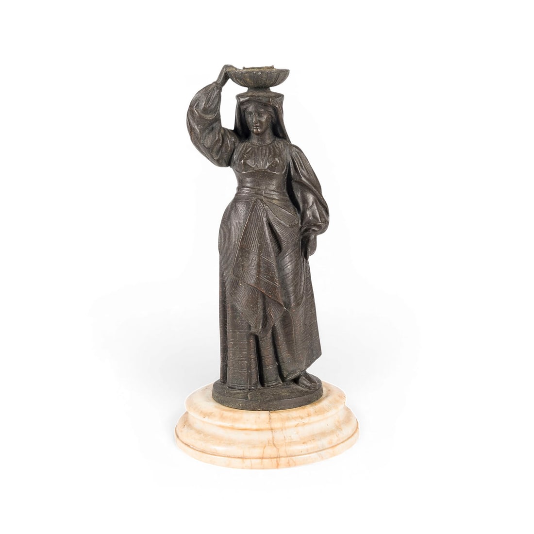 ITALIENISCHER BILDPLASTIKER | 'FRAU IN TRACHT' ALS FIGUeRLICHER KERZENLEUCHTER: ITALIAN SCULPTOR Active early 20th century 'WOMAN IN TRADITIONAL COSTUME' AS A FIGURAL CANDLEHOLDER Bronze, dark patina, on a round marble base; supporting a shallow, bowl-shaped candle nozzle on her 