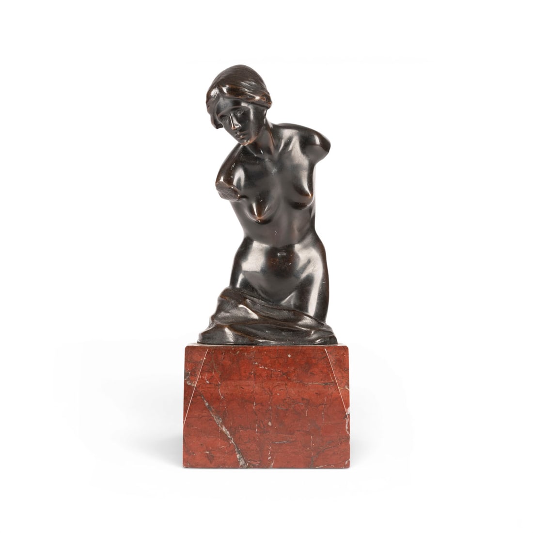 DANIEL STOCKER | WEIBLICHER TORSO: DANIEL STOCKER 1865 Stuttgart - 1957 Stuttgart FEMALE TORSO Bronze, black patina, marble base (H. 7 cm). Total H. 22 cm, W. 9.5 cm, D. 7.5 cm, weight approx. 1.8 kg. Signed 'Dan Stocker' on the side. 
