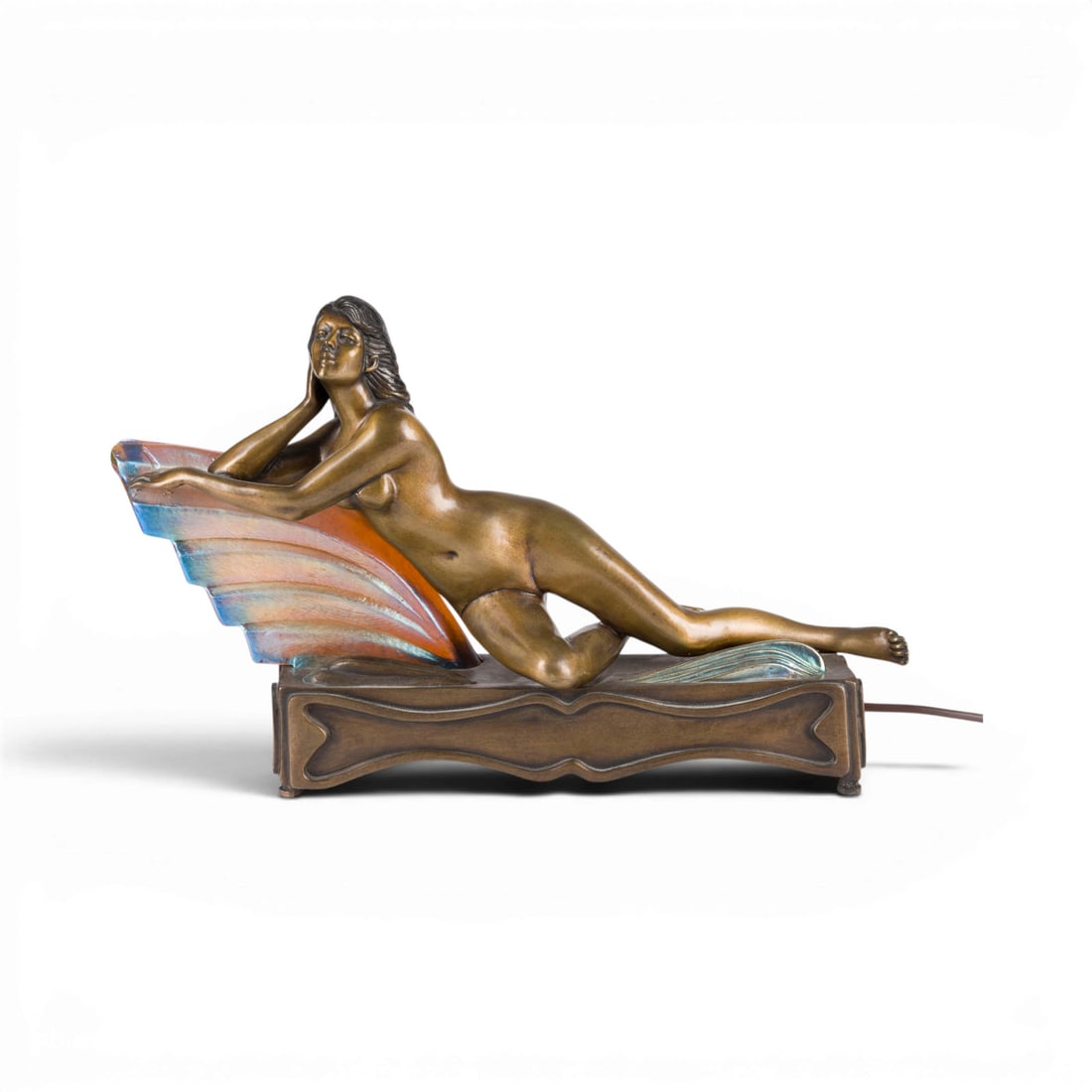 DEMETRE HARALAMB CHIPARUS | 'LIEGENDER FRAUENAKT': DEMETRE HARALAMB CHIPARUS 1888 Dorohoi, Romania - 1947 Paris (after) 'RECLINING FEMALE NUDE' Bronze, metal, and colored glass. H. 28, L. 44, D. 13 cm; weight approx. 9 kg. Marked on the back 'D. H.