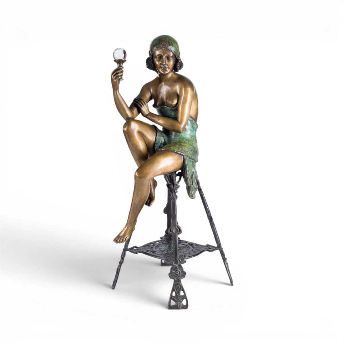 FERDINANDO DE LUCA | 'THE CHAMPAGNE GIRL': FERDINANDO DE LUCA Active 20th century, Italy 'THE CHAMPAGNE GIRL' Bronze with brown patina, metal, glass sphere. H. 74, W. 30, D. 35 cm. Unsigned. Full-figure sculpture of a young, scantily clad woma