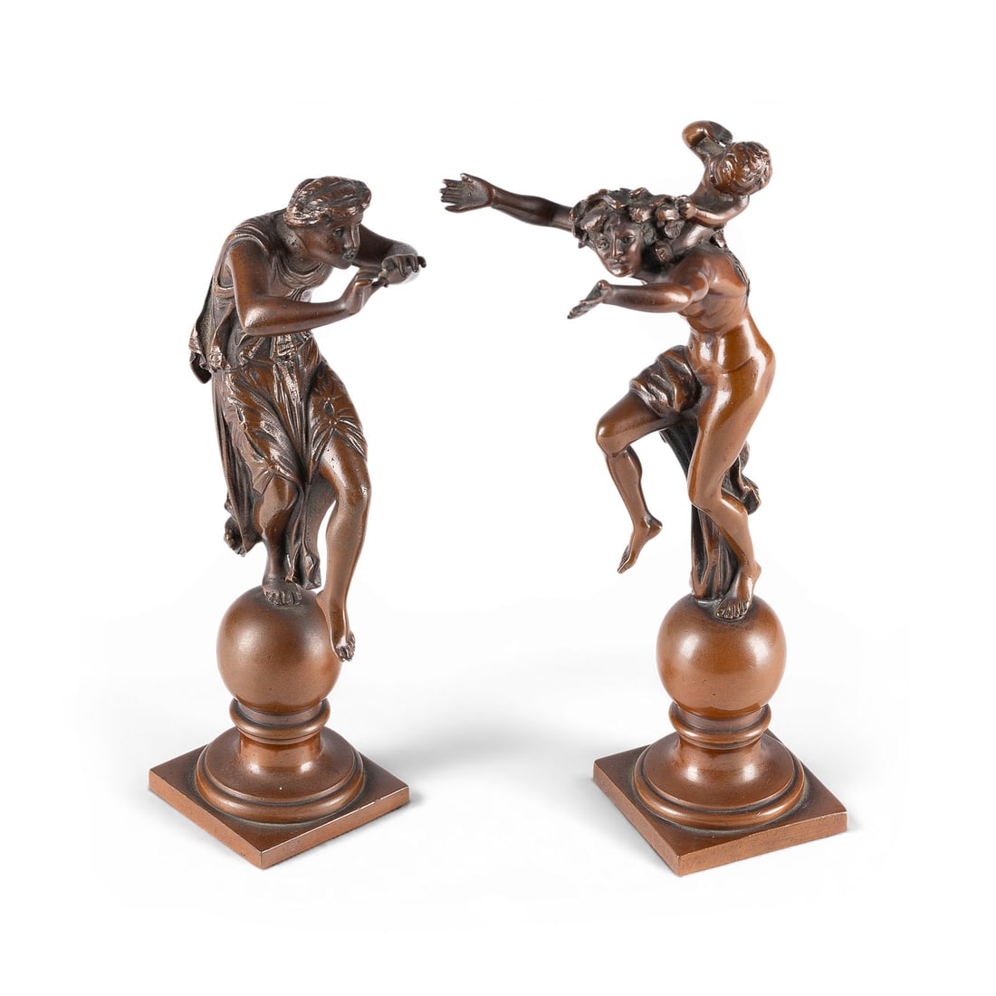 FRANZOeSISCHER BILDPLASTIKER | FIGURENPAAR: 'BACCHANT MIT FAUN' UND 'NYMPHE': FRENCH SCULPTOR Active early 20th century PAIR OF FIGURES: 'BACCHANT WITH FAUN' AND 'NYMPH' Bronze, brown patina; each figure stands on a sphere set upon a stepped, square bronze base. Height 18/17 cm