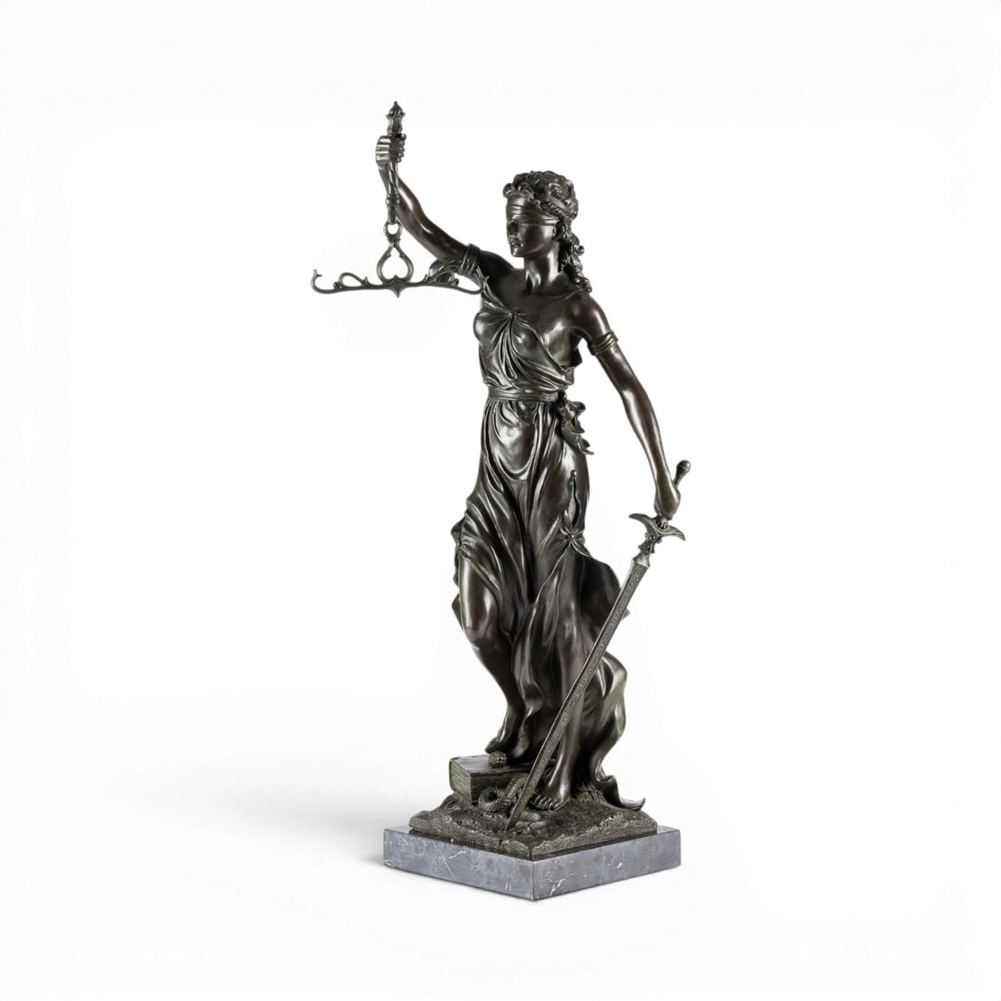 UNBEKANNTER BILDPLASTIKER | JUSTITIA: UNKNOWN SCULPTOR Active 20th century JUSTITIA Bronze, dark patina, on a plinth and marble base. Total height 76 cm, width 22 cm, depth 36 cm. Unsigned. Full-round depiction of Justitia as the