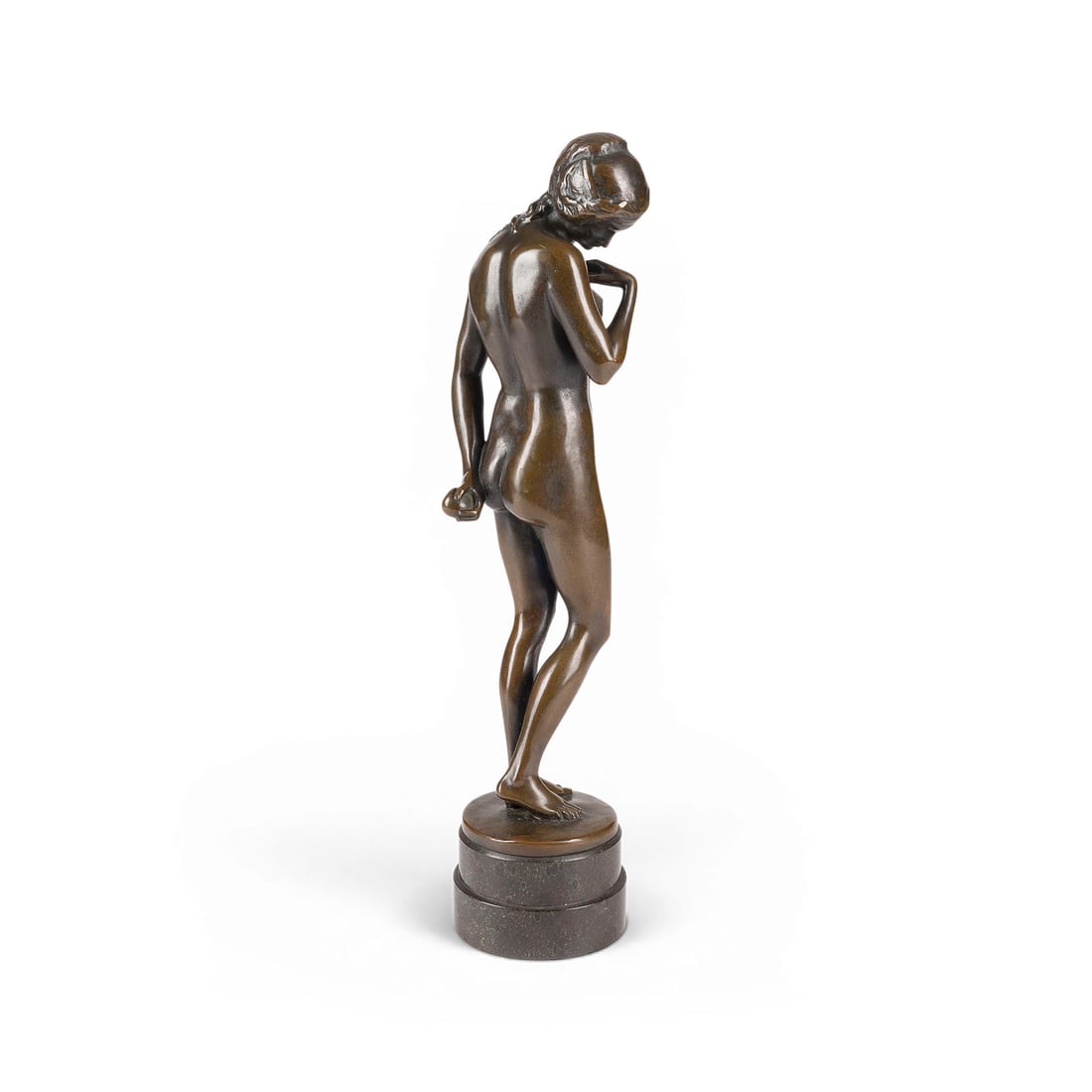 LISSY ECKHART | STEHENDER FRAUENAKT MIT APFEL (SUeNDENFALL EVA): LISSY ECKHART 1891 Munich - 1974 Munich STANDING FEMALE NUDE WITH APPLE (EVE AFTER THE FALL) Bronze, dark patina, round base. H. 33.5, W. 9.5, D. 8.5 cm; weight approx. 1.81 kg. Signed 'Lissy