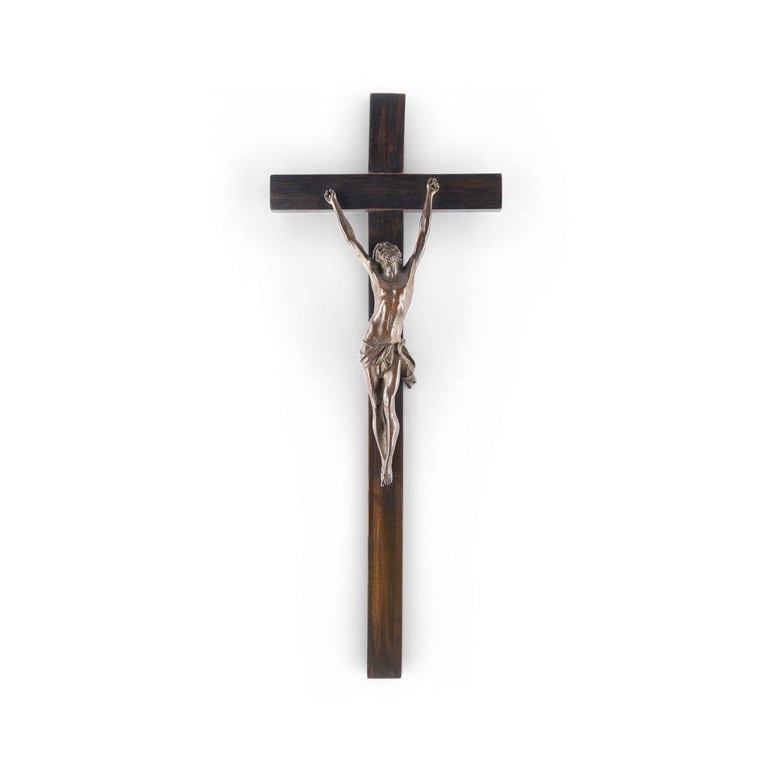 UNBEKANNTER BILDPLASTIKER | KRUZIFIX: UNKNOWN SCULPTOR Active 19th/20th century CRUCIFIX Bronze, dark patina, wooden cross (51 x 20 cm). Figure height 26 cm. Areas of rubbing and loss of patina.UNBEKANNTER BILDPLASTIKER Taetig im 19./
