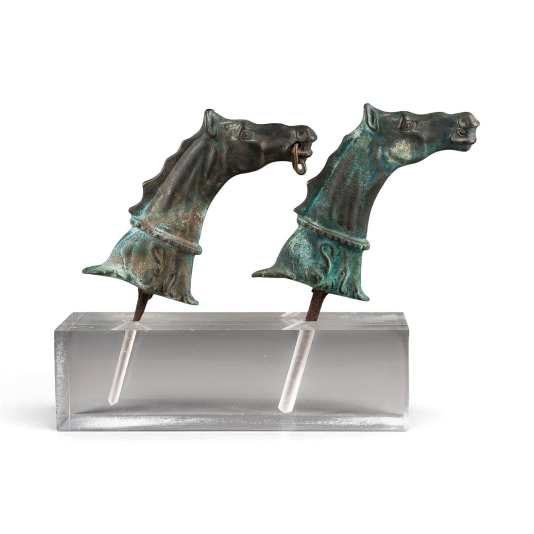 ITALIENISCHER BILDPLASTIKER | PAAR VENEZIANISCHE 'CAVALLI' (PFERDEKOePFE ALS GONDEL-BESCHLAeGE): ITALIAN SCULPTOR Active in the 19th/20th century PAIR OF VENETIAN 'CAVALLI' (HORSE HEADS AS GONDOLA FITTINGS) Bronze, dark patina, each on a spike, metal noseband, with acrylic glass base (11x35x12