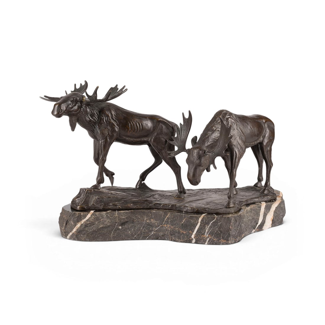 M. BAUER | ZWEI ELCHE: M. BAUER German sculptor, active c. 1900 TWO MOOSE Bronze, dark patina, on a naturalistic plinth and marble base (H. 6 cm). Total H. 27, W. 44, D. 17.5 cm. Signed 'M. Bauer' on the plinth. Minor