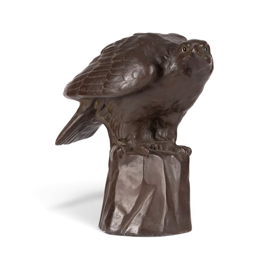 JOSEF FRANZ PALLENBERG | SITZENDER ADLER: JOSEF FRANZ PALLENBERG 1882 Cologne - 1946 Duesseldorf SITTING EAGLE Plaster, brown-toned finish, glass eyes, on a naturalistic base. H. 45, W. 49, D. 25 cm. Incised signature 'Jos. Pallenberg' on the