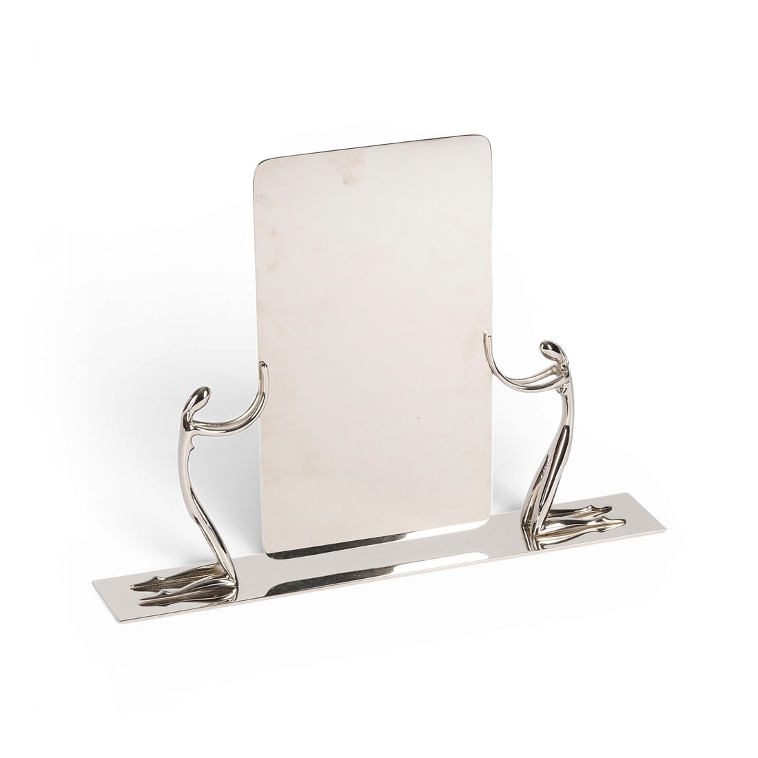 KARL HAGENAUER | SPIEGEL MIT ZWEI KNIENDEN FRAUENFIGUREN: KARL HAGENAUER 1898 Vienna - 1956 Vienna MIRROR WITH TWO KNEELING FEMALE FIGURES Werkstaette Hagenauer Wien, c. 1930 Nickel-plated and polished brass. H. approx. 28, W. 36, D. 6.5 cm. Marked on the re