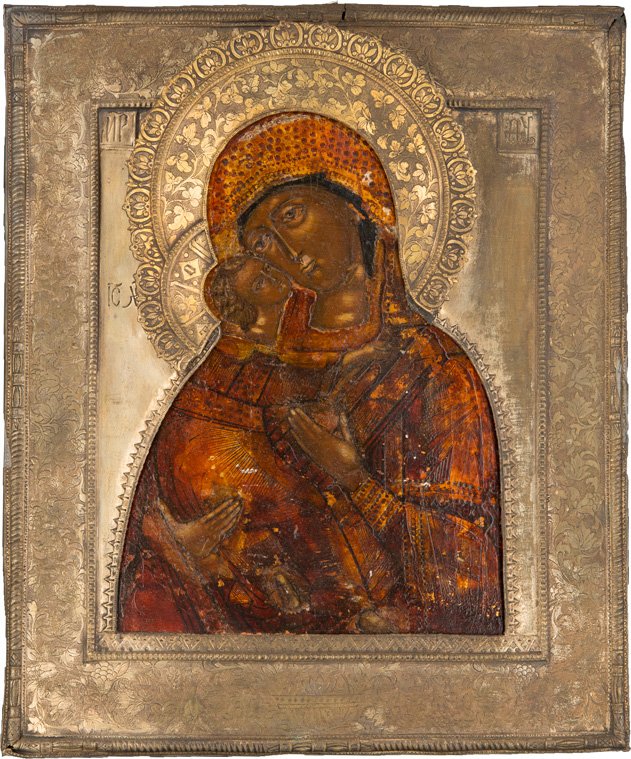 GOTTESMUTTER WLADIMIRSKAJA MIT RIZA: THE MOTHER OF GOD OF VLADIMIR Russian, 18th century (icon), Russian, 19th century (basma) Tempera on wood panel. Traditionally painted in sombre colours. Oberlaid with a brass oklad engraved with foli