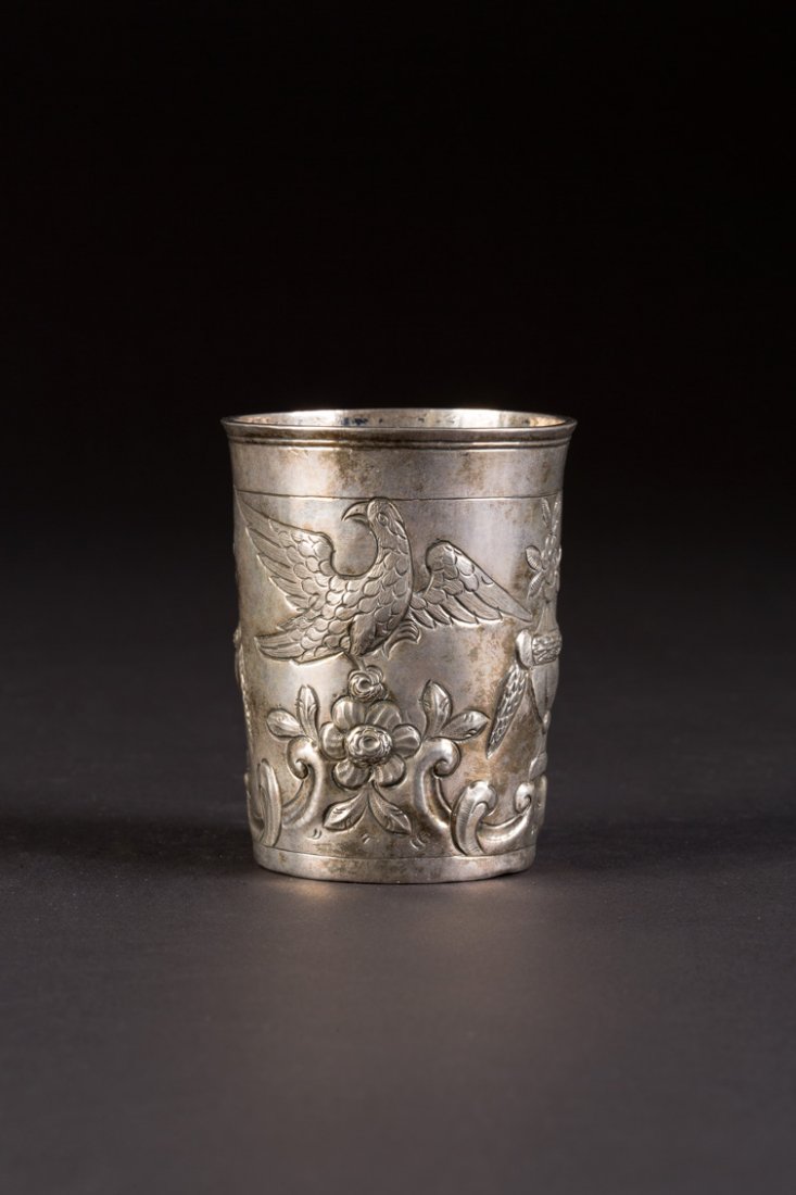 ROKOKO-BECHER: A SILVER BEAKER Russian, Moscow, Andrei Dementiev, 1788 Of cylindrical form, repoussÃ© and chased with flowers and eagles. Marked with city hallmark, assayer's mark, alderman's mark and master's mar