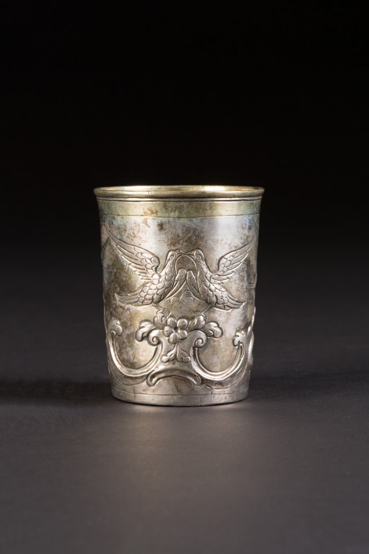 ROKOKO-BECHER: A SILVER BEAKER Russian, Moscow, 1787 Of tapering form, repoussÃ© and chased with rococo scrolls and eagles. Marked under base with city hallmark, assayer's mark, alderman's mark and master's mark E