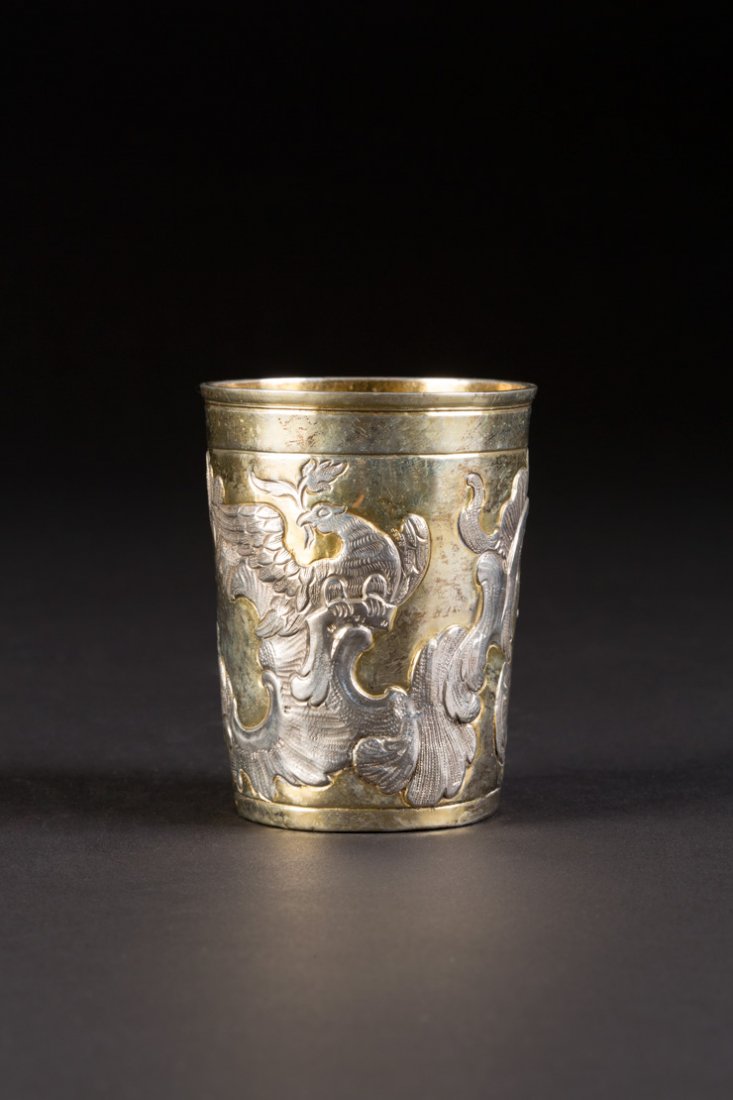 ROKOKO-BECHER: A SILVER PARCEL-GILT BEAKER Russian, Moscow, Timofey Filippov, 1774 Of tapering form, repoussÃ© and chased with rococo scrolls and eagles. Marked under base with city hallmark, assayer's mark, alder