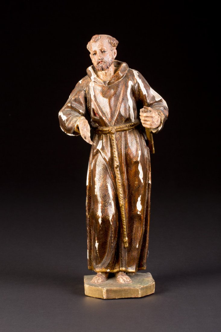 HEILIGER FRANZISKUS: HEILIGER FRANZISKUS Spanien, 18. Jh. Holz, plastisch geschnitzt, polychrom gefasst und vergoldet, rückseitig geflacht. H. 38,5 cm. Über einem Sockel ganzfigurige Darstellung des Heiligen Franziskus