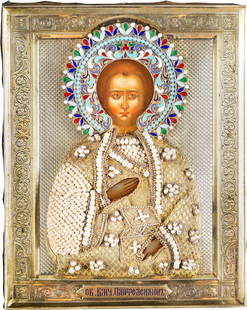 ST. PANTELEIMON THE HEALER WITH SILVER-GILT AND ENAMEL: ST. PANTELEIMON THE HEALER WITH SILVER-GILT AND ENAMEL OKLAD Russian, late 19th century (icon), Moscow, 1896-1908 (oklad) Tempera on wood panel. The saint depicted half-length holding a box of medicin