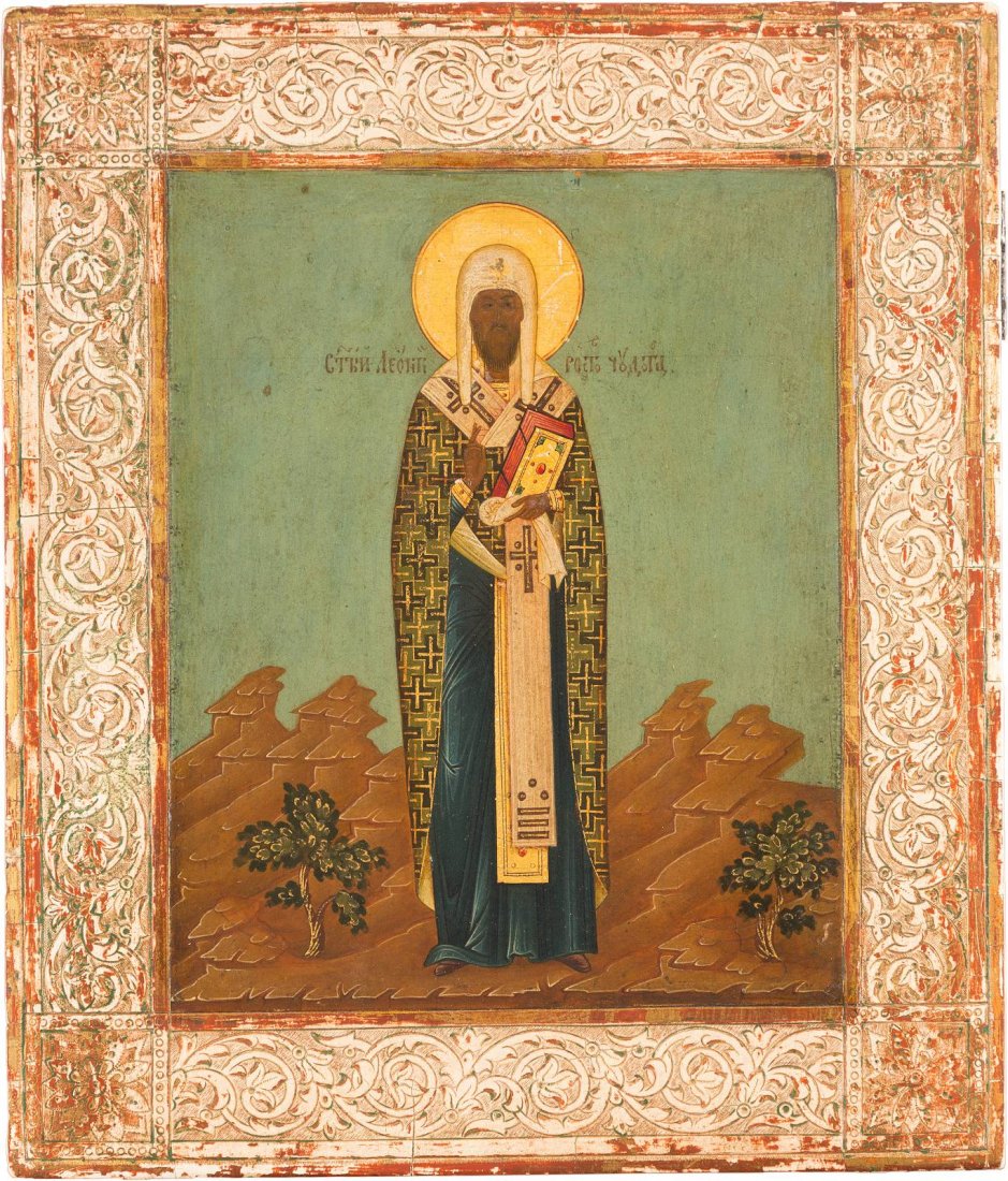 ST. LEONTI OF ROSTOV Russian, circa 1880 Tempera on: ST. LEONTI OF ROSTOV Russian, circa 1880 Tempera on wood panel. The saint depicted full length in richly decorated bishop's vestments with cruciform pattern. Finely executed against a rocky landscape.