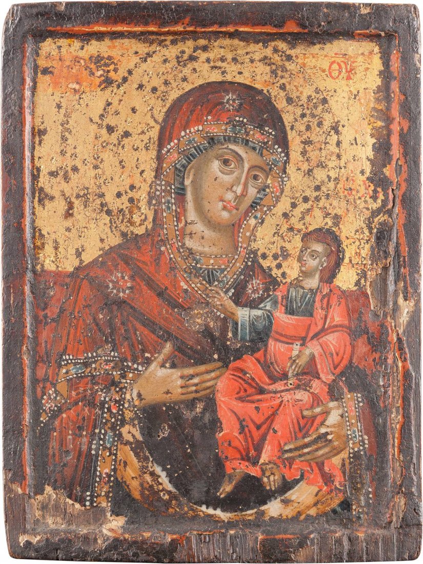 A SMALL ICON SHOWING THE HODIGITRIA MOTHER OF GOD: A SMALL ICON SHOWING THE HODIGITRIA MOTHER OF GOD Greek, 18th century Tempera on wood panel with kovcheg. Executed on a gold ground. The haloes ornamentally punched. Losses. 19.1 x 14.5 cm. KLEINE IKO
