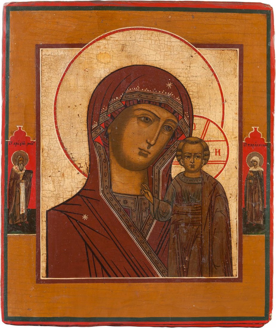 AN ICON SHOWING THE KAZANSKAYA MOTHER OF GOD Russian,: AN ICON SHOWING THE KAZANSKAYA MOTHER OF GOD Russian, circa 1800 Tempera on wood panel. Traditionally painted. With two family patrons on the borders. The background stripped to gesso, minimally resto
