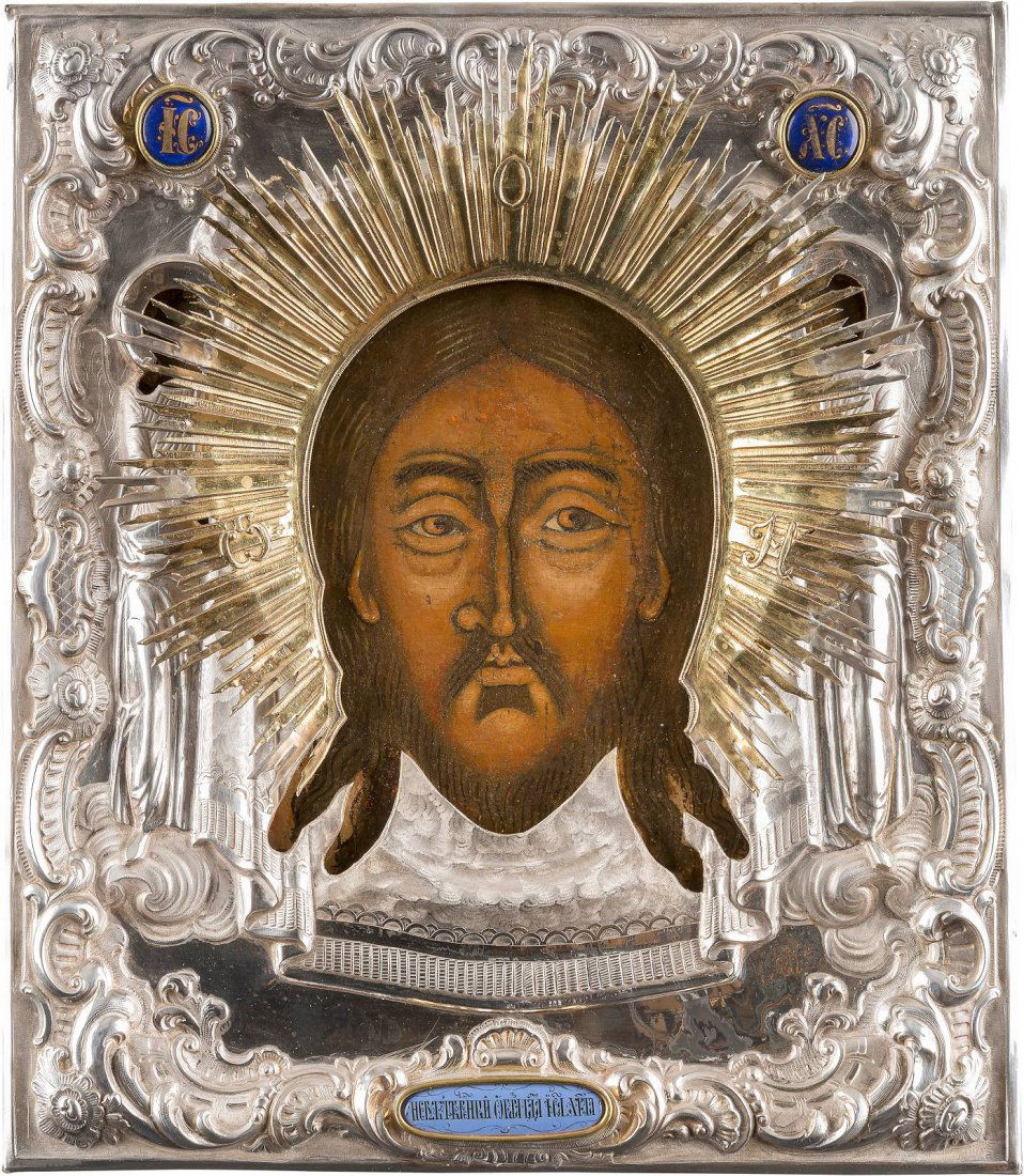 AN ICON SHOWING THE MANDYLION WITH SILVER OKLAD (1 of 2)