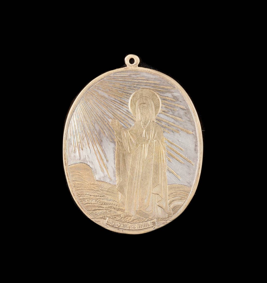 A SILVER PARCEL-GILT MEDALLION SHOWING ST. ANNA (1 of 1)