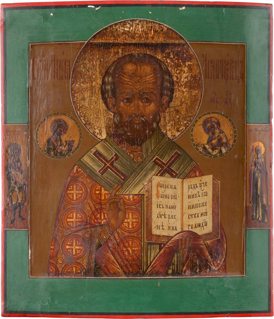 AN ICON SHOWING ST. NICHOLAS OF MYRA Russian, 19th: AN ICON SHOWING ST. NICHOLAS OF MYRA Russian, 19th century Tempera on wood panel with kovcheg. The haloes made of silver, covered by a golden lacquer. Two selected saints on the borders. The borders r