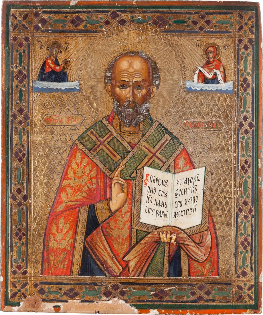 AN ICON SHOWING ST. NICHOLAS OF MYRA Russian, circa: AN ICON SHOWING ST. NICHOLAS OF MYRA Russian, circa 1870 Tempera on wood panel. The background made of silver, covered by a golden lacquer. Minimal losses to the borders, minimally restored. 26.7 x 22