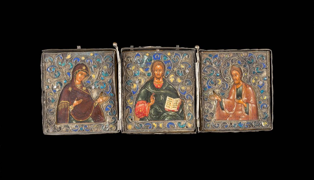A VERY FINE AND SMALL TRIPTYCH SHOWING THE DEISIS WITH: A VERY FINE AND SMALL TRIPTYCH SHOWING THE DEISIS WITH ENAMELLED RIZA Russian, 17th century Tempera on wood panels. Metal-mount decorated with scrolling foliage in blue, green and yellow cloisonnŽ en