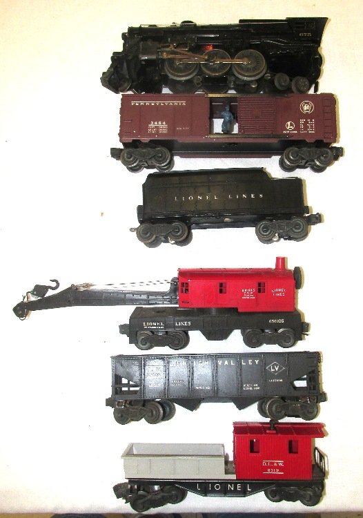 Lionel #675 Freight Train Set: Set includes #675 Steam Type Engine with matching Tender, #2456 Gondola, #3484 Operating Box Car, #656025 Red Crane, and #6119 Working Caboose. All original. Excellent