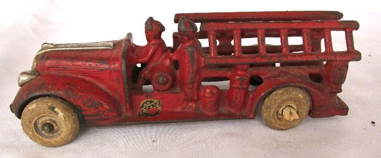 Cast iron Fire Engine Pumper with rubber wheels, Arcade: Cast iron Fire Engine Pumper with rubber wheels, Arcade c.1930, 6 3/4"L, VG broken bumper & Replaced Tire