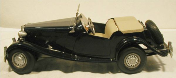 Doepke "Model Toys" MG Sports Car. Die Cast Met: Doepke "Model Toys" MG Sports Car. Die Cast Metal with working Streering wheel and rubber tires, 15" long, Made in USA 54-56