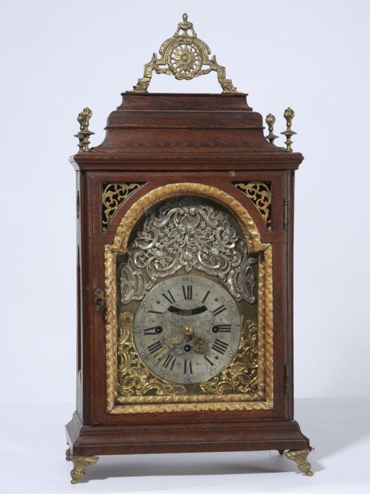 Baroque clock 18th century: signed Joh. Martin Koller, about 1750 oak case, brass applications, verge escapement, beating on two bells, repeater, silvered dial, gold plated brass, the machine is running, with no guarantee of acc