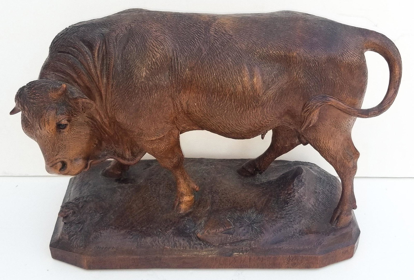 Black Forest Carving 1 of 20: Black Forest Carving 1 of 20 Bull. Carved wood with inset glass eyes. 9.5 x 14 x 6.1 inches. Warm patina. Provenance: This German Austrian Swiss Bavarian Alpine figural carving is one of twenty in the