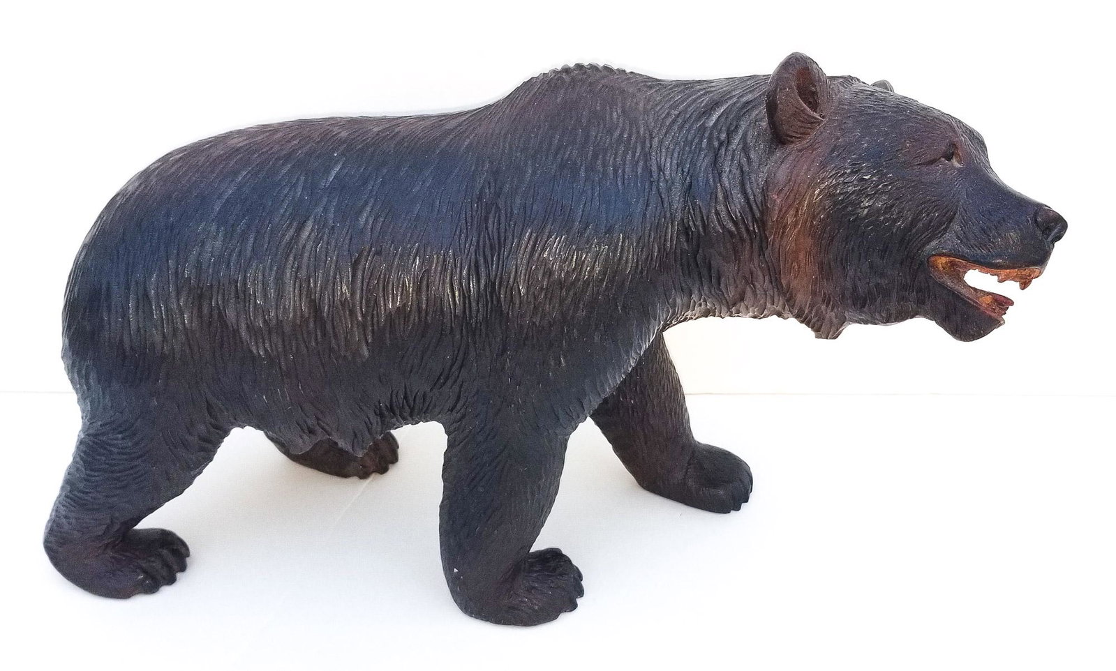 Black Forest Carving 2 of 20: Black Forest Carving 2 of 20 Bear. Carved wood with glass inset eyes. Painted mouth. Warm patina. 6.6 x 12 x 4.3 inches. Provenance: This German Austrian Swiss Bavarian Alpine figural carving is one o
