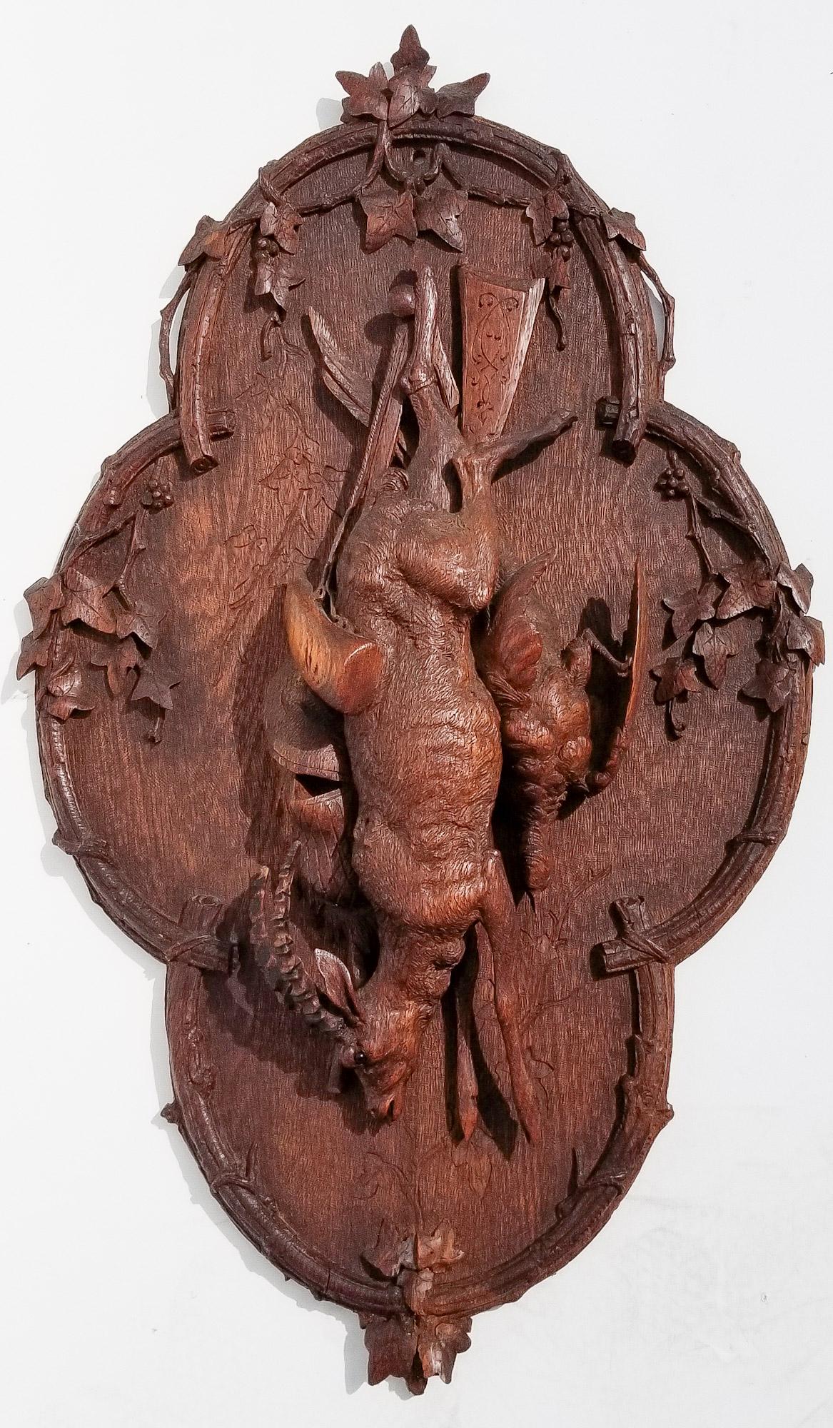 Black Forest Carving 10 of 20: Black Forest Carving 10 of 20, ram hanging game relief plaque, 34 x 21 x 4.5 inches, eyes appear to be inset glass. Provenance: This German Austrian Swiss Bavarian Alpine figural carving is one of twe
