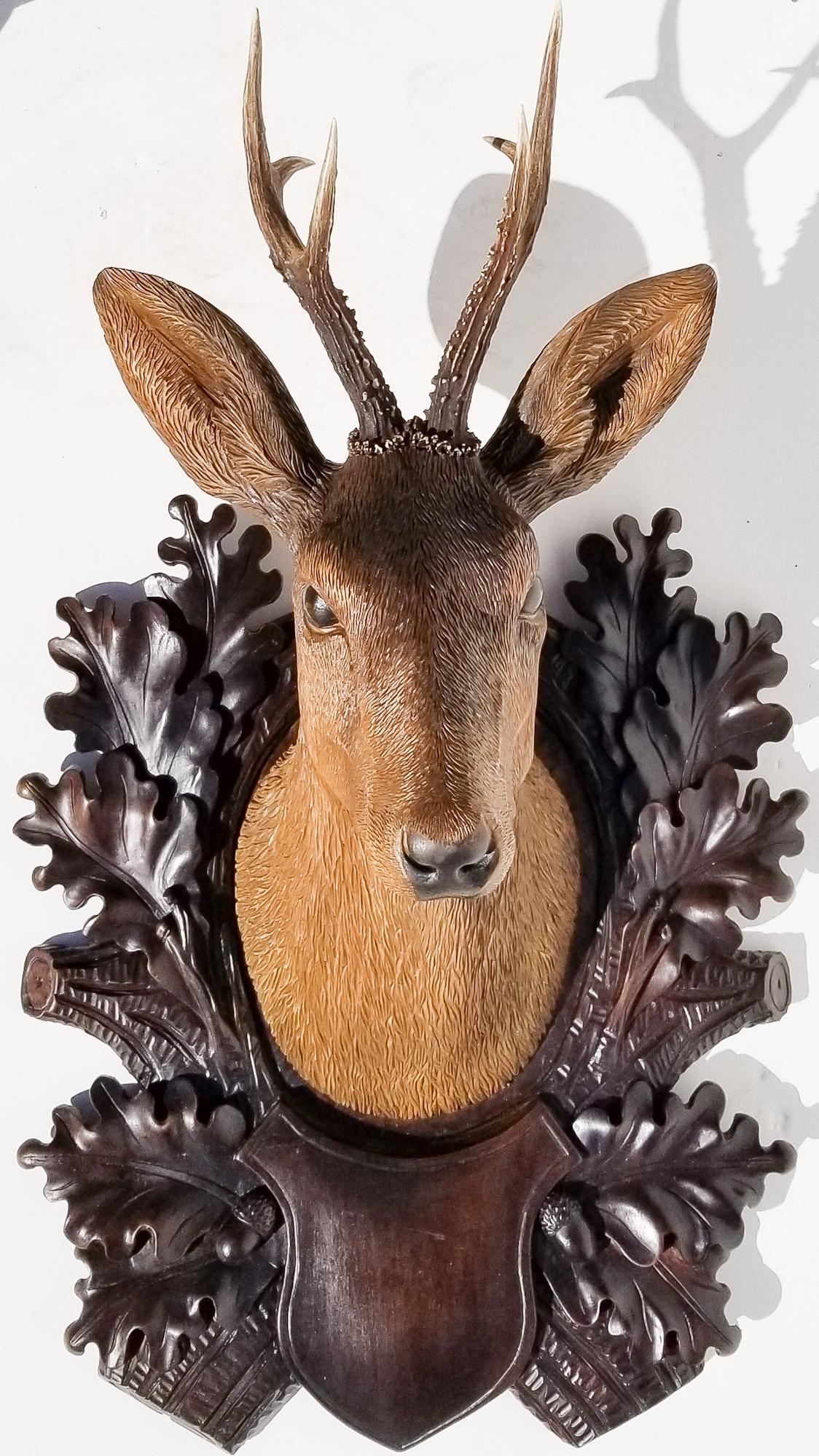 Black Forest Carving 19 of 20: Black Forest Carving 19 of 20, large modern deer stag plaque, varnish eyes, 30 x 18 x 11.5 inches. Provenance: This German Austrian Swiss Bavarian Alpine figural carving is one of twenty in the sale f