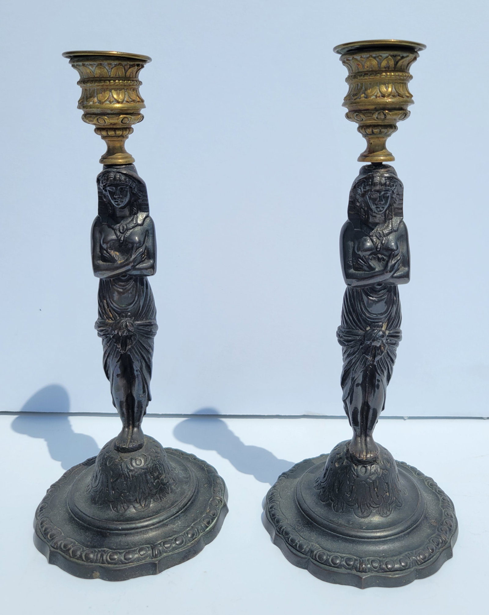 Pair Antique Grand Tour Bronze Egyptian Revival Continental Candlesticks Dore Tops Nude Likely: Provenance:Waterfront Bayshore Tampa Florida 50 year collector estate, name withheld by heirs.Description: Pair Antique Grand Tour Bronze Egyptian Revival Continental Candlesticks Dore Tops Nude Likel
