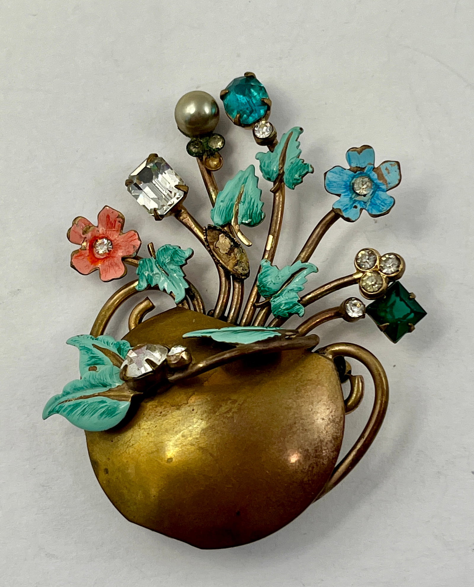 Fine Pre War Brass Enamel Paste Floral Vase Vintage European Brooch Pin 0.63Tozt: Fine Pre War Brass Enamel Paste Floral Vase Vintage European Brooch Pin. Featuring a charming bouquet of hand-painted enamel flowers in shades of blue, pink, and green. The brooch also includes unveri