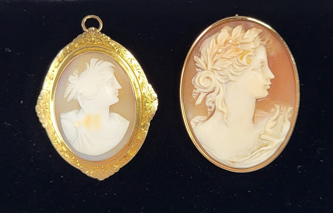 Lot 2 Gold Framed Carved Shell Cameo Portraits Both Pendant Brooches 10K And 14K 1.4 And 1.6 Inches: Lot 2 Gold Framed Carved Shell Cameo Portraits Both Pendant Brooches 10K And 14K 1.4 And 1.6 Inches 13.2 Tg 8.5 Tdwt Boxed, the shorter cameo has yellow hued gold, 10K on the pin clasp and is engraved