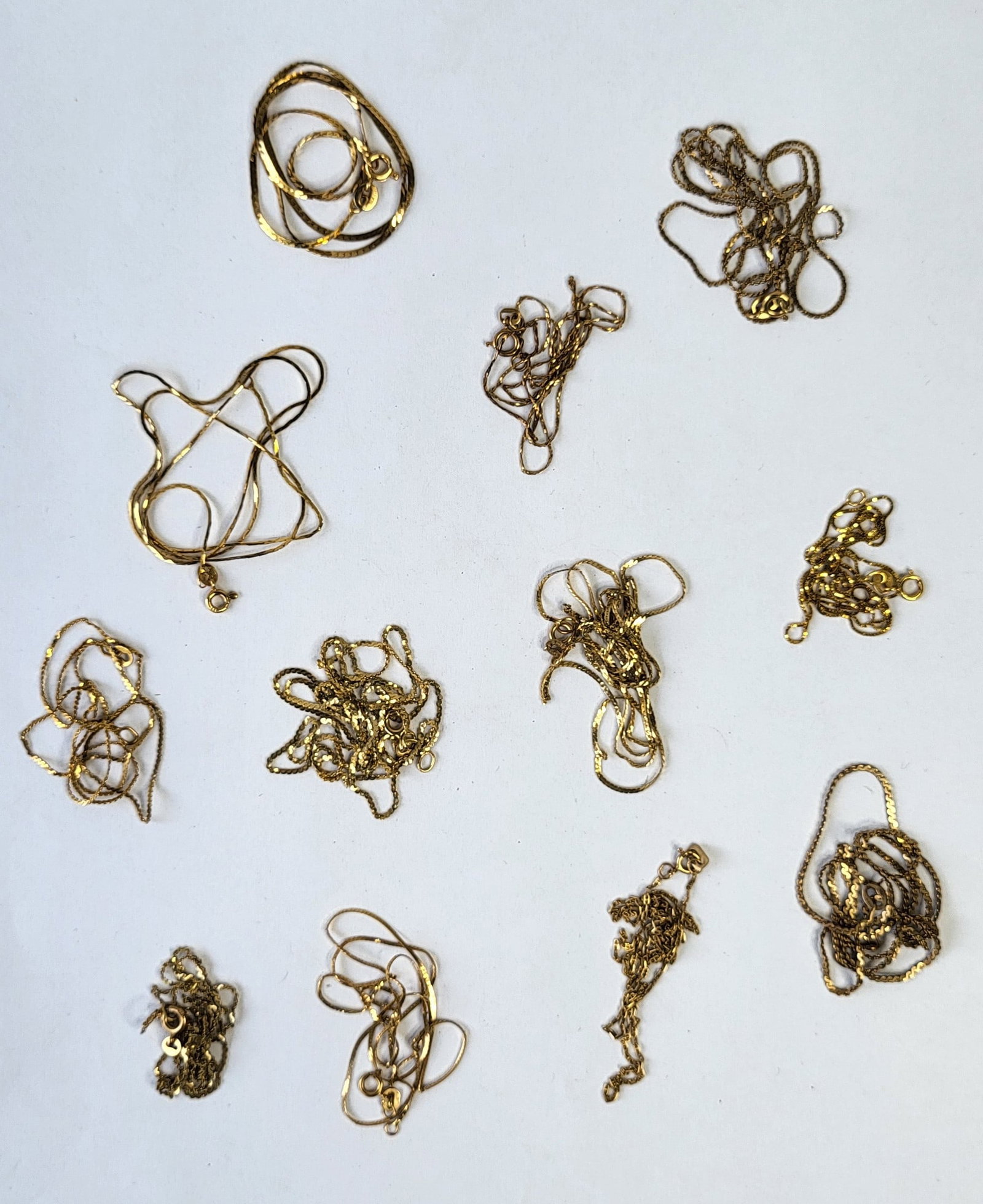 Lot 12 Marked 14K Gold Chains 12.4 Dwt: Lot 12 Marked 14K Gold Chains 12.4 Dwt, thin, various lengths, see condition report. Provenance: Property of a Florida Gulf Coast funeral industry professional who in their spare time and later retire