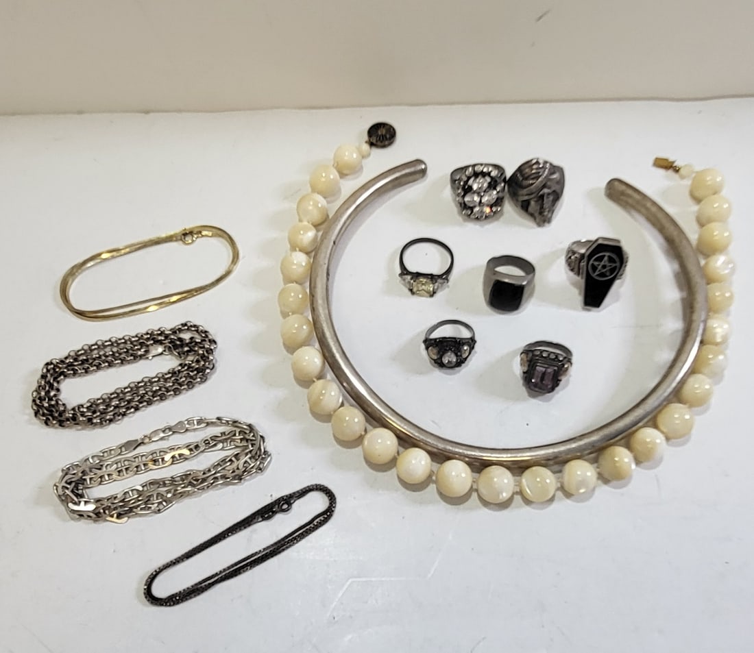 Estate 925 Sterling Ring And Necklace 13 Pc Jewelry Lot Over 125g Silver: Estate 925 Sterling Ring And Necklace 13 Pc Jewelry Lot Over 125g Silver. Includes a pentagram opening coffin ring with skeleton turbaned Arab face ring, rhinestone synthetic diamond, amethyst or synt