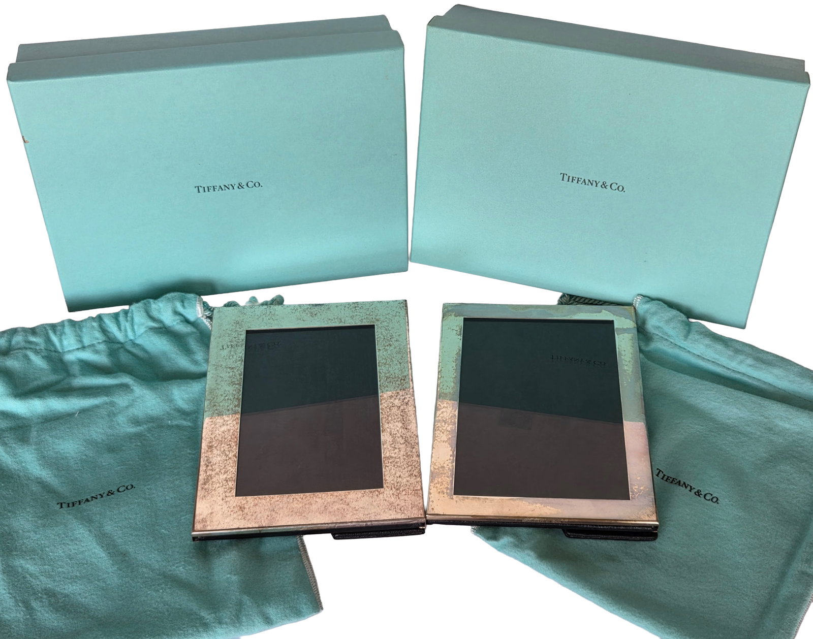 Lot 2 Genuine Tiffany Co Sterling Silver Picture Frames Box Pouch: Lot 2 Genuine Tiffany Co Sterling Silver Picture Frames. Each comes with a box and pouch. Both measure 7.25 inches tall, 5.125 inches wide and 0.25 inch thick. Each signed Tiffany Co 925 Spain. Boxes 