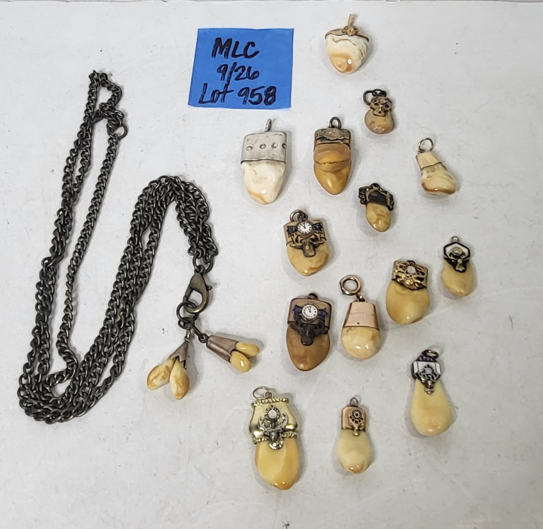 Elks Tooth BPOE Gold Teeth 14K 10K Enamel Lifetime Fraternal Collection: Elks Tooth BPOE Gold Teeth 14K 10K Enamel Lifetime Fraternal Collection, this lot contains 15 metal mounted teeth. One charm is marked 14K and another medallion is marked 10K, the other 13 fobs are un