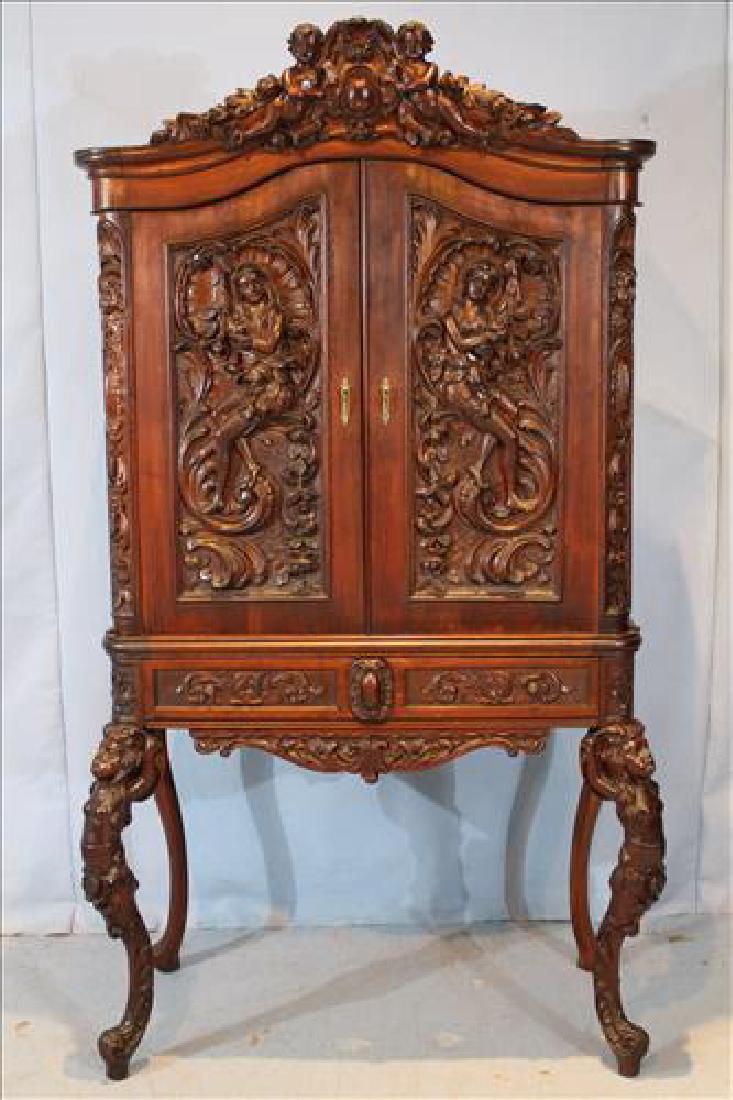 Walnut Victorian wine cabinet with cupids and ladies: Walnut Victorian wine cabinet with cupids and ladies, 69 in. T, 38 in. W, 18 in. D.