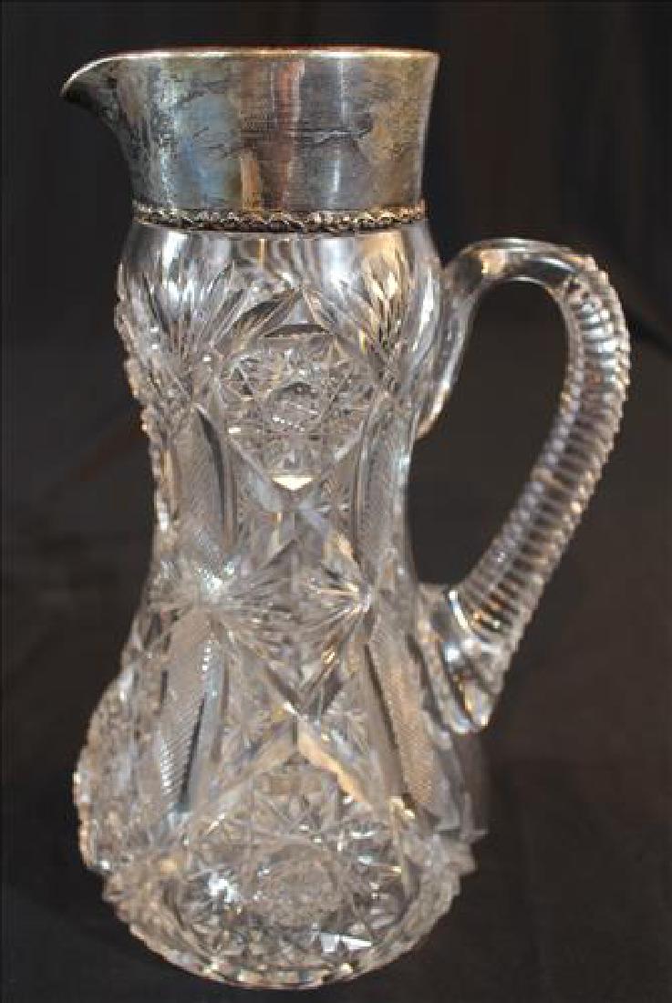 Brilliant cut glass water pitcher with sterling rim (1 of 2)