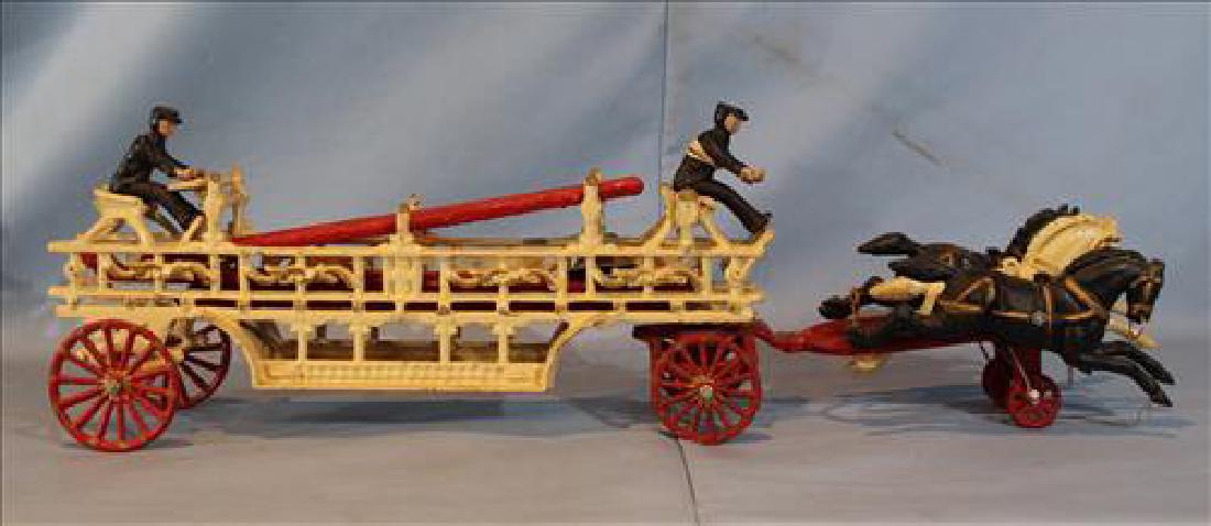 Cast iron toy fire engine with moving parts (1 of 3)
