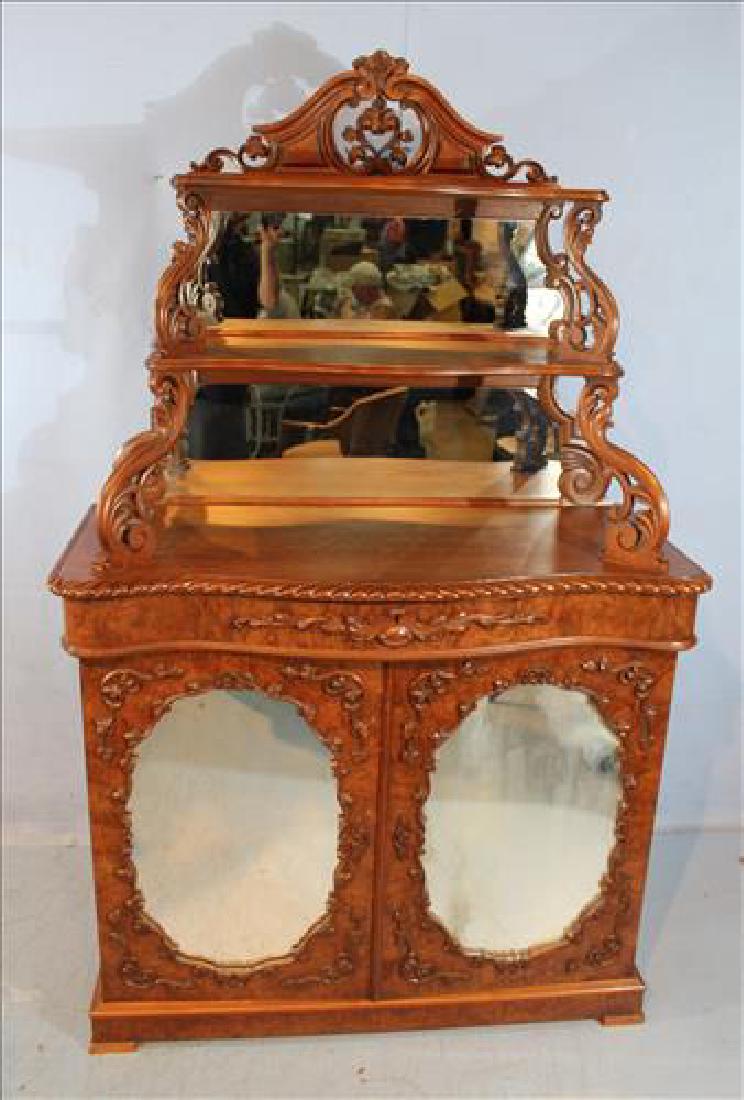 Fiddle back walnut cabinet etagere with pierce carving: Fiddle back walnut cabinet etagere with pierce carving, 74.5 in. T, 46 in. W, 40 in. D.