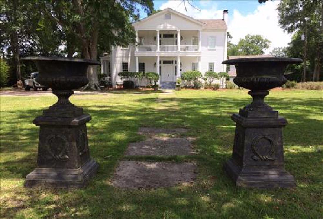Cast iron pair garden urns on stand, 5 ft. T. (1 of 2)