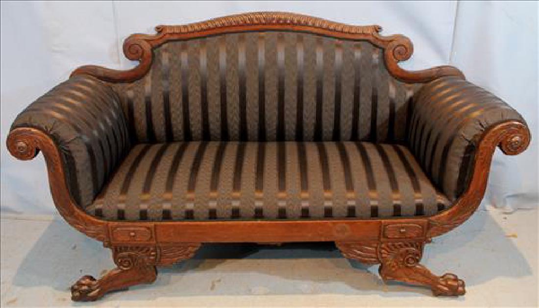 Mahogany Empire loveseat with ball and claw feet: Mahogany Empire loveseat with ball and claw feet in great condition, black stripe upholstery, 35 in. T, 64 in. W, 19 in. D.