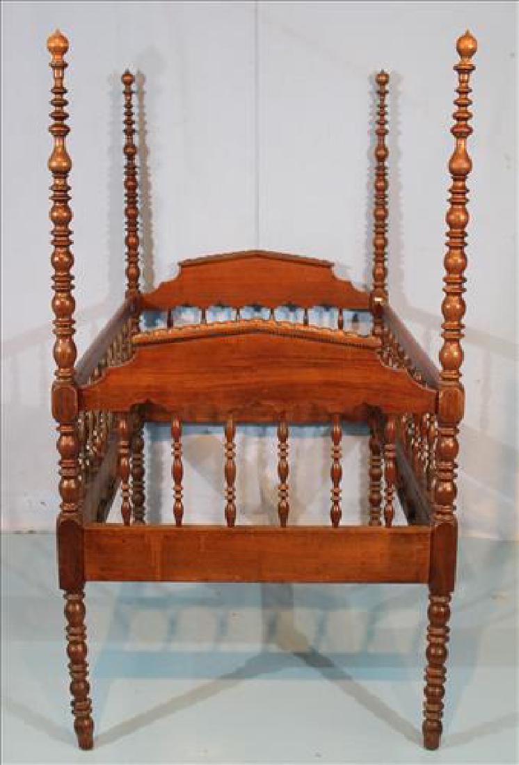 Walnut Victorian Jenny Lind baby bed, 63 in. T, 31 in.