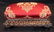 Small mahogany carved footstool with red upholstery