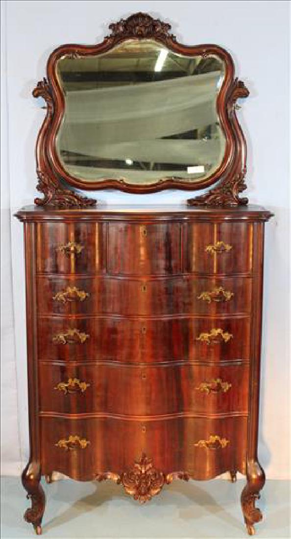 Mahogany highboy chest with bevel mirror and carved: Mahogany highboy chest with bevel mirror, carved crown and original pulls, 79 In. T, 39 in. W, 21 in. D.